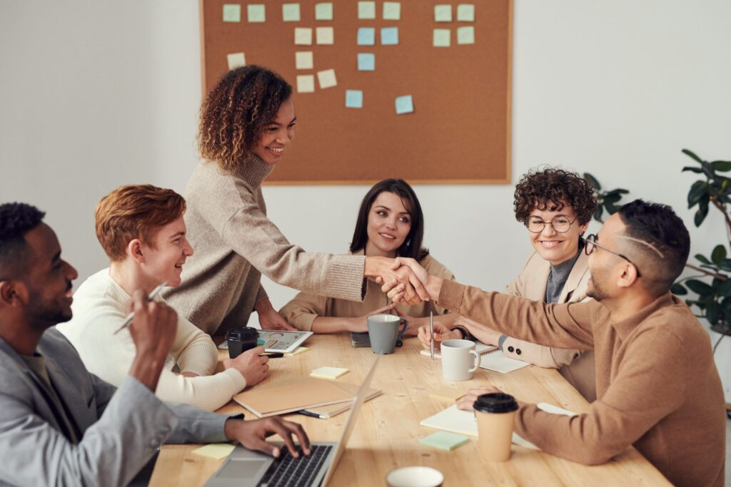 group of people sitting indoors working together